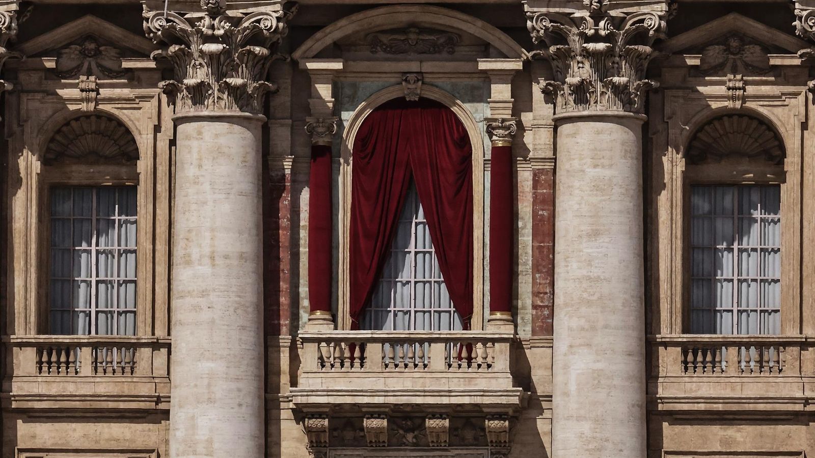 Vatican City. Red drapes are wrapped around columns of the central lodge of St. Peter's Basilican Vatican city, before the Conclave starting on May 7, where the 267th pontiff of the Catholic Churc will be elected. ÂEvandroInetti_via ZUMA - Evandro Inetti / Zuma Press / ContactoPhoto
